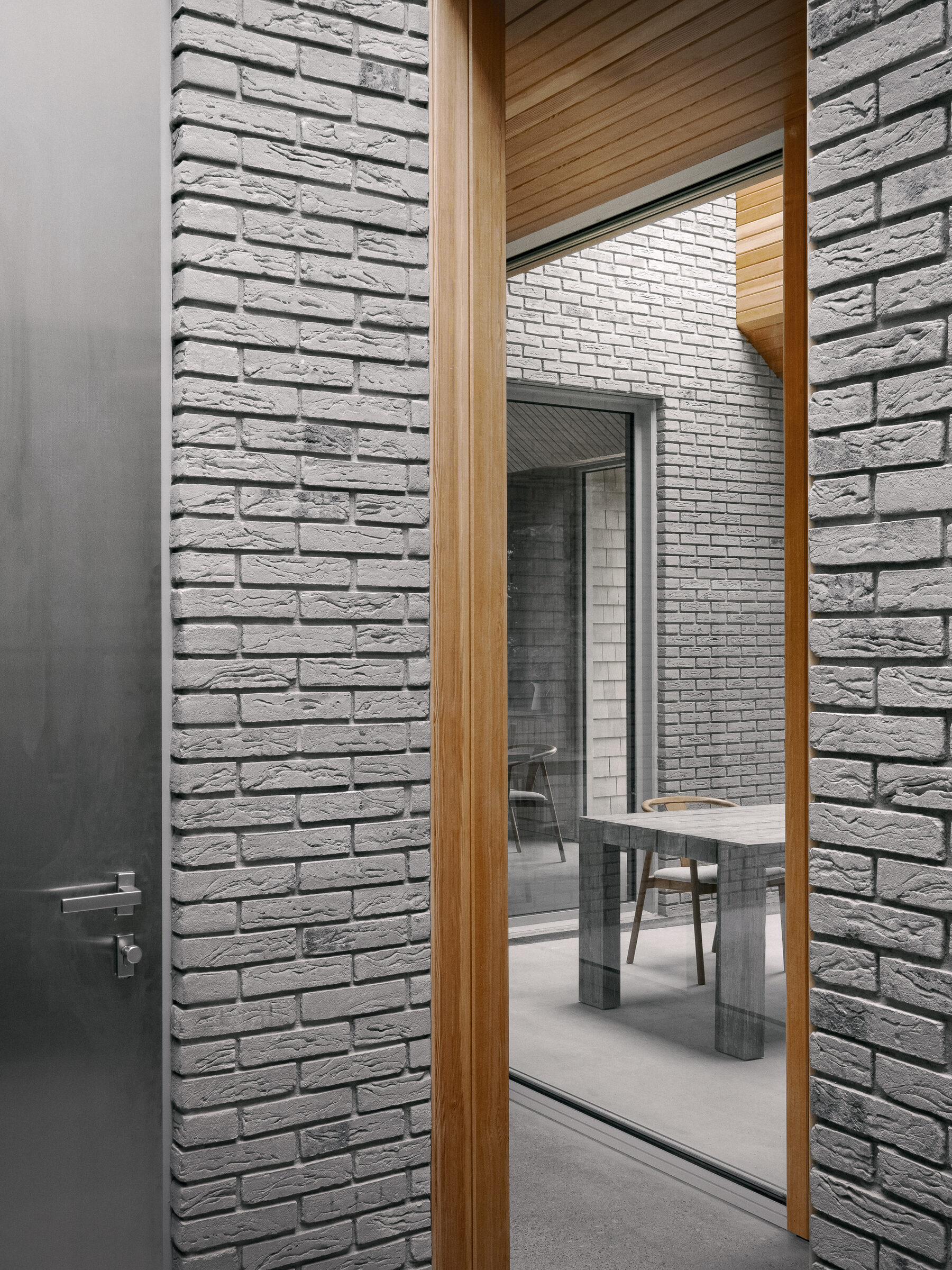 Brick doorway framing the dining room beyond