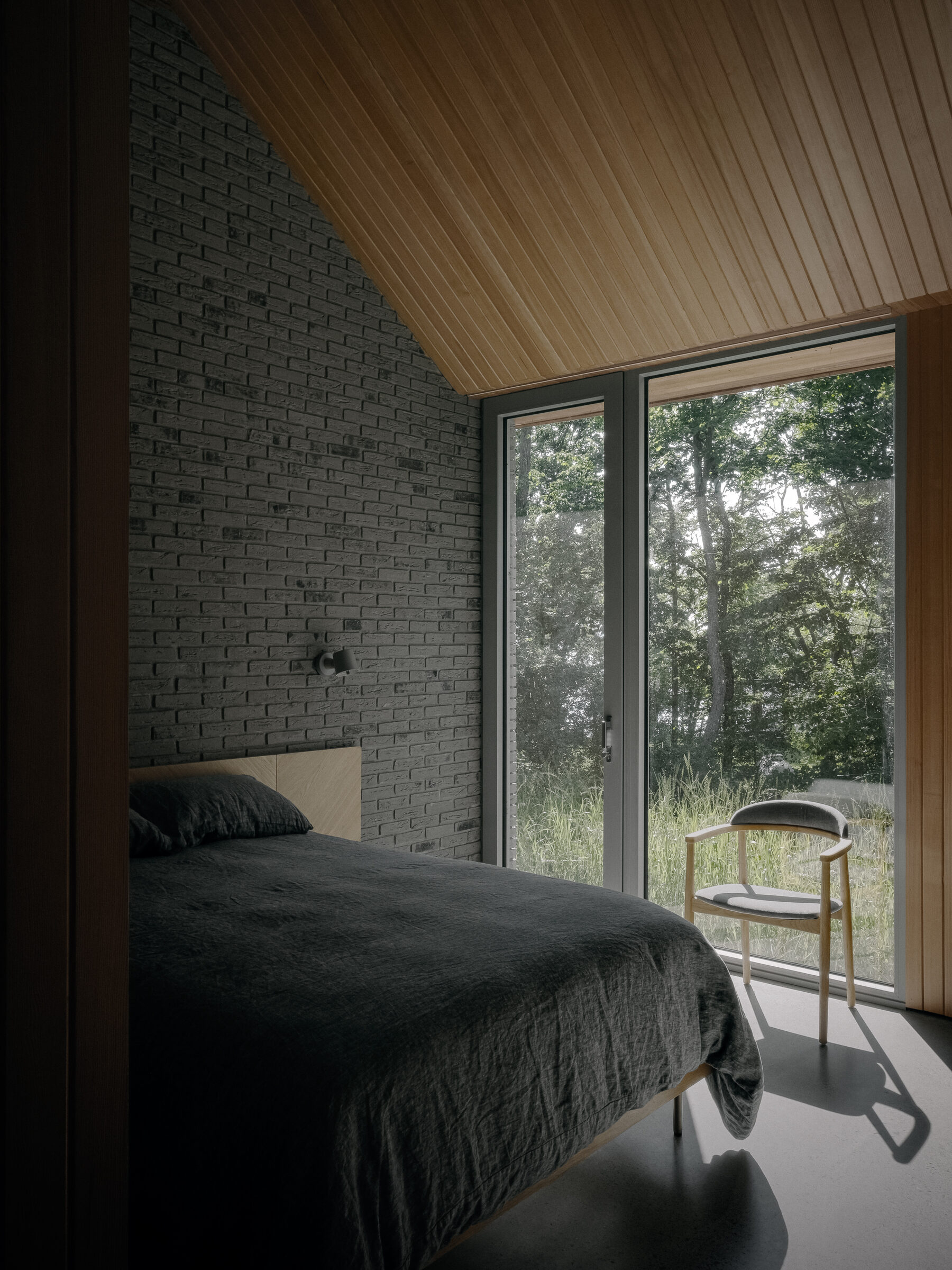 Bedroom with brick accent wall